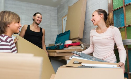 Moving boxes and furniture prepared for Kilburn removals in a busy London property