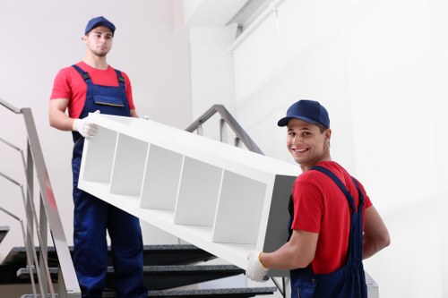 Removal team member handling boxes safely during a move