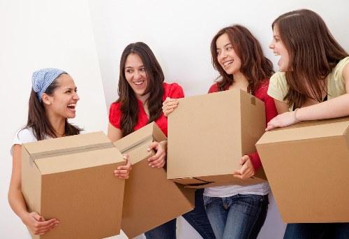Professional removal services in Kilburn with moving van and packed boxes