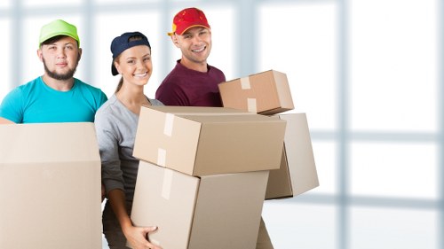 Professional movers handling a flat relocation in Kilburn