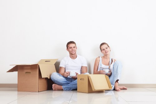 Professional movers loading boxes for a Kilburn same day move