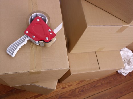 Office furniture removals service in Kilburn with packing equipment