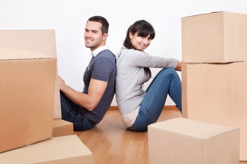 Removalists carefully handling furniture during a Kilburn move