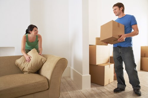 Same day removals service in Kilburn with packed boxes and van